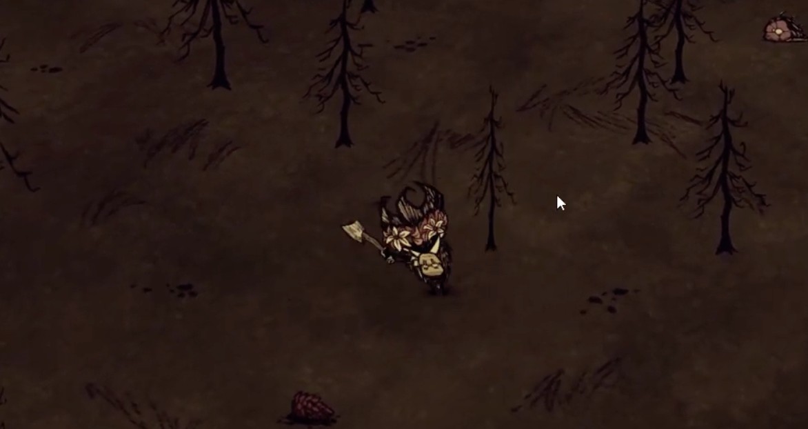 A player harvesting charcoal from burned trees in Don't Starve.